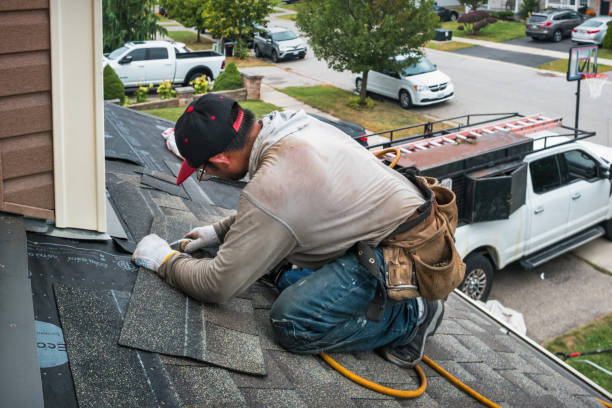 Professional Roof Replacement technician working in Levittown, NY